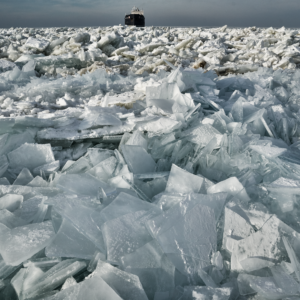 a ship is trapped in a giant windrow of ice