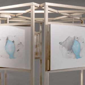 two graphite drawings with cyan blue centres in a delicate wooden structure. The frames can tilt from side to side.
